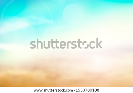 Summer Holiday Concept: Abstract Blurred Light Beach with Autumn Sky Sky Background