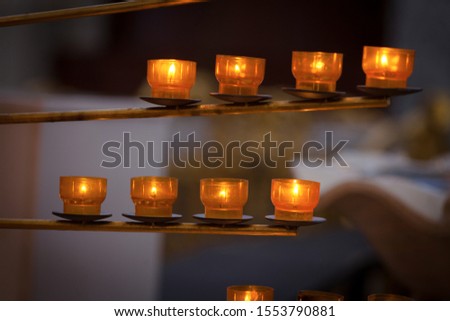 beautiful warm light candles in cathedral
