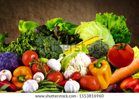 Fresh vegetables on a colorful background. Variety Of Raw Vegetables Royalty-Free Stock Photo #1553816960