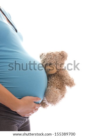 A pregnant woman with a bear on a white background