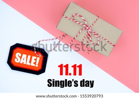 Online shopping of China, The shopping boxes with red rope and shopping tag on a white and pink background with copy space for text. 11.11 single's day sale concept