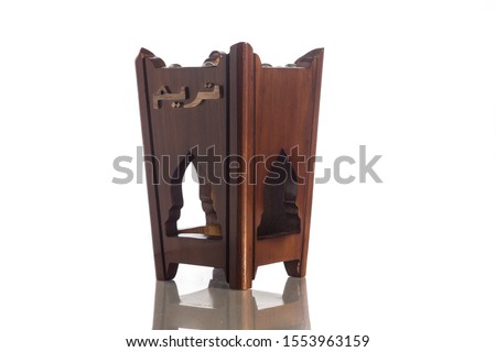 Isolated picture. Unique wooden shape design of "bakhoor" burner. "Bakhoor" is name given to agarwood chips that have been soaked with jasmine and sandalwood to soften the heavy scents. Arab perfume.