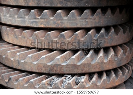 A pile of old rusty differential gears