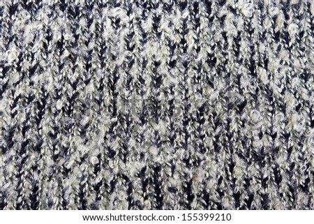 Knitted wool gray background closeup