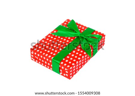 Christmas or other holiday handmade present in red paper with Green ribbon. Isolated on white background, top view. thanksgiving Gift box concept.