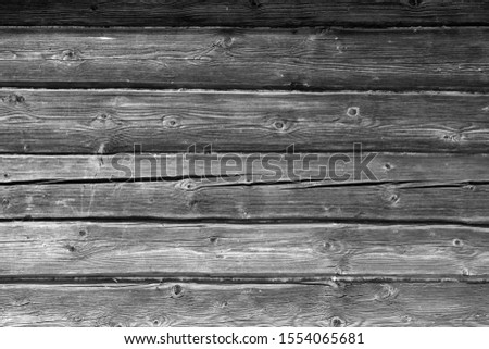 Old grungy wooden planks background in black and white. Abstract background and texture for design.   