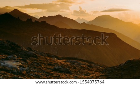 
Sharp Alps peaks, rocks without people. View over Alpine rocks above deep vallyes to far horizon
