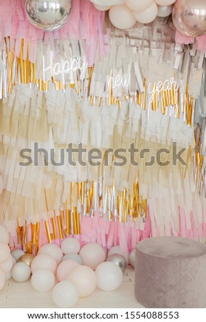 Fashionable party and Christmas photo zone. Neon and colorful tissue paper decorations