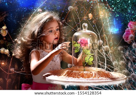 Charming baby in the image of Belle from the fairy tale "Beauty and the Beast"saw a rose under a glass jar.
