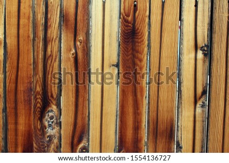 Close up photo of a wooden fence