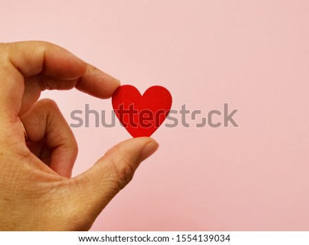 Valentines day concept, Love concept, Woman hand holding red heart with white wooden background and copy space.

 Royalty-Free Stock Photo #1554139034