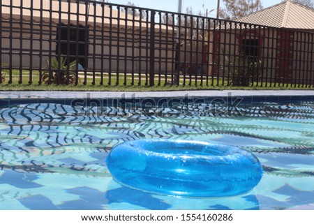 A nice picture of a swimming pool with one safety tool
