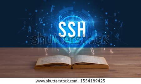 SSH inscription coming out from an open book, digital technology concept