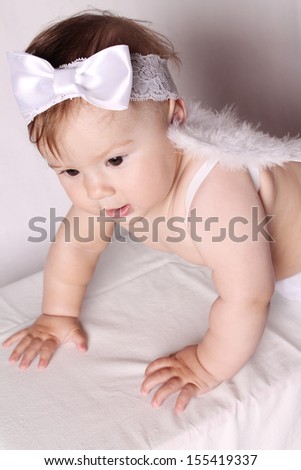Close-up of a baby with angel wings