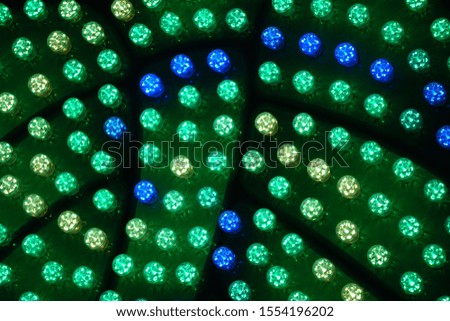 Green and Blue Dynamic Light. Beautiful Festive Night Background. Neon Lights and Lanterns in Darkness. 