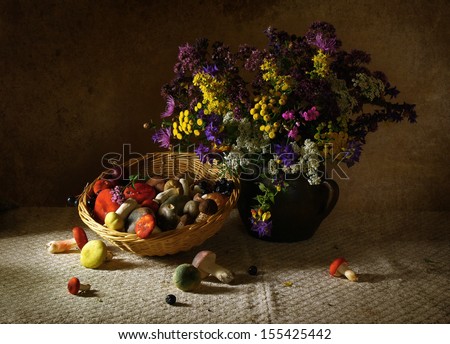 Beautiful still life with wild flowers and mushrooms