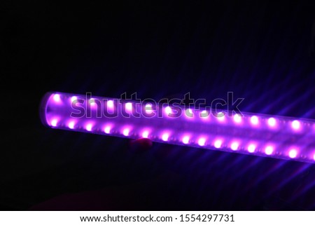 purple led light rod photography
