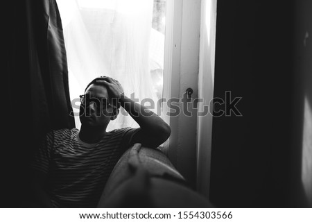 panic attacks alone young man sad fear stressful depressed emotion.crying begging help.stop abusing domestic violence in people,person with health anxiety,people bad frustrated exhausted feeling down Royalty-Free Stock Photo #1554303566