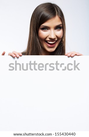 Close up business woman portrait. White background female portrait. Smiling girl hold white blank card.
