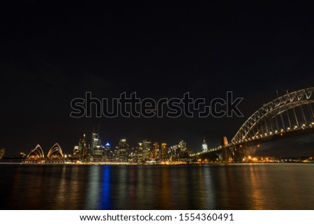 Sydney harbour and bridge at night with beautiful reflection.Selective focus shot.