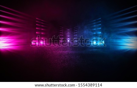 Empty background scene. Dark street reflection on the wet pavement. Rays neon light in the dark, neon figures, smoke. Night view of the street, the city. Abstract dark background. Abstract spotlight. 
