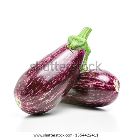 Two ripe graffiti eggplants isolated on a white background. Food concept.