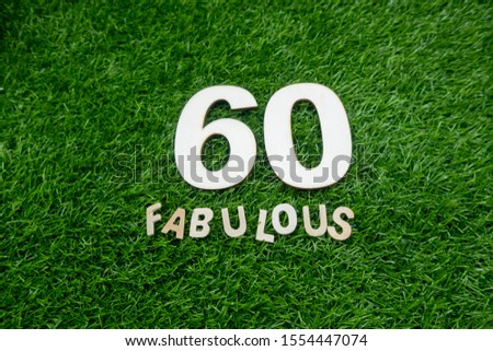 sixty and fabulous number on green grass