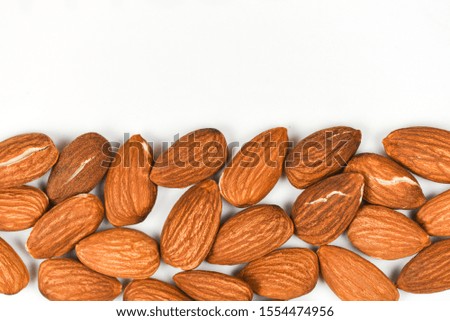Almonds texture background and copy space / Close up almond nuts natural protein food and for snack , top view selective focus 