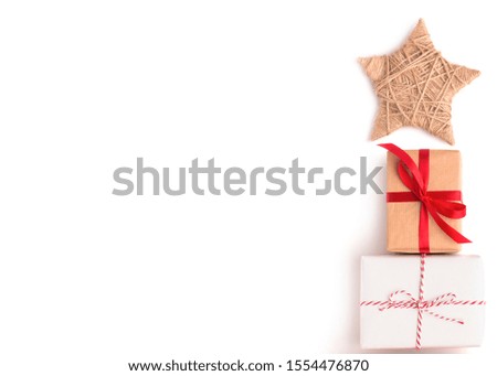 Merry Christmas and Happy New Year. Greeting card with gift boxes in shape of Christmas tree with star on white, copy space