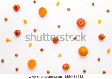 Healthy life concept. Juicy vegetables background with tomatoes on white