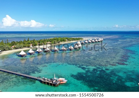 Drone New Caledonia Noumea overwater bungalows reef island Royalty-Free Stock Photo #1554500726