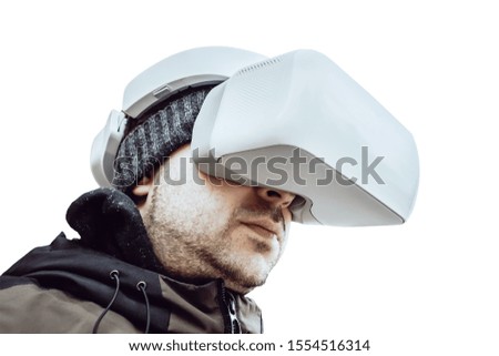 a man stands in a virtual reality helmet on a white isolated background