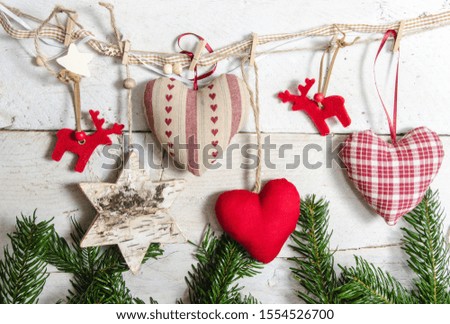 Merry Christmas: decoration collection, gifts and decorative ornaments, hearts, stars and reindeers on white, wooden background