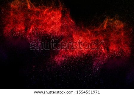 Multicolor powder explosion on black background. Colored cloud. Colorful dust explode. Paint Holi.