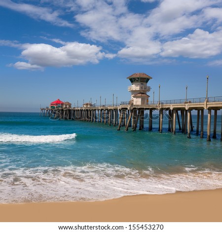 Huntington beach Surf City USA pier view with sand and waves