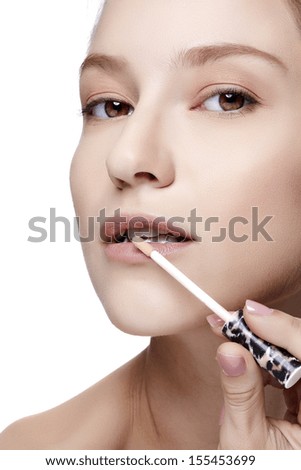 Closeup portrait picture of beautiful woman with lipstick on the white background.-Studio shot