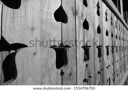 hearts and flower shapes, engraving in wood panel