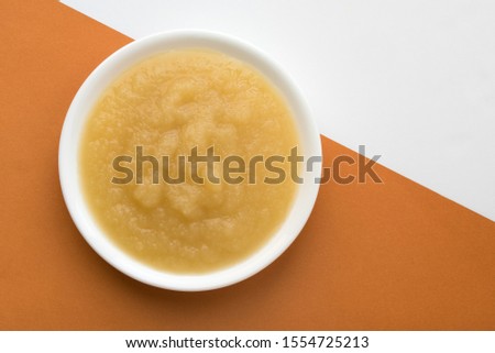 Applesauce in a White Bowl Royalty-Free Stock Photo #1554725213