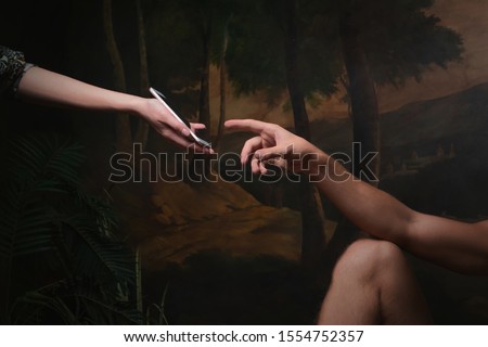 Smartphone screen touch, fingerprint recognition, concept. A funny remake of the creation of Adam, technology and modernity in the style of Renaissance paintings Royalty-Free Stock Photo #1554752357