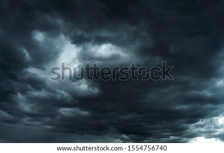 Storm dark clouds, dramatic background Royalty-Free Stock Photo #1554756740