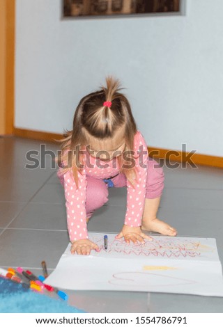 Childhood, creativity, drawing and people concept - happy little  girl with sketchbook and pencil