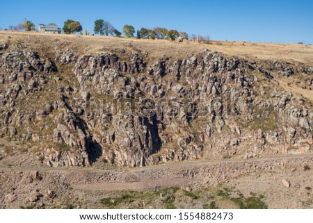 Rocks & hills that surrounding medieval Kars Castle & it's making siege of fortress from north side almost impossible. Picture taken from most higher point of city, from citadel, Kars, Turkey