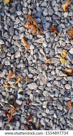 small road stone background, dark gravel pebbles stone texture
