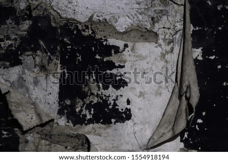old wall background with torn drapery. Unusual original old vintage background for design.