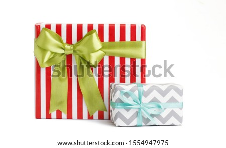 Christmas gift boxes decorated with ribbon bow on white background