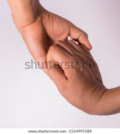
Weakly holding both hands only with fingers on a white background.