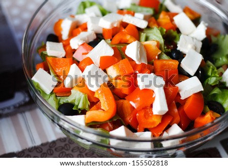 Greek salad in a glass bowl. background close-up