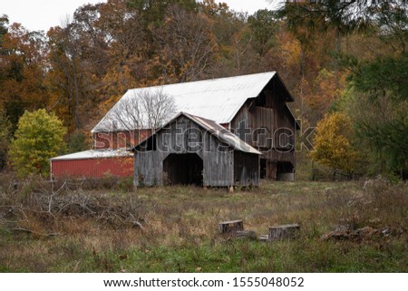 Antique Barn in Front of Autumn Foliage