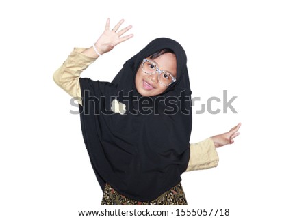 Portrait of cute A  young asian little girl 6-7 years old muslim, wearing hijab, show face  expression
