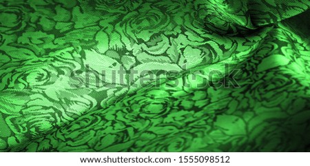 relief pattern, composite textiles, green silk fabric with a floral pattern, unusually pleasant visual sensations: slippery, coolness, softness; beautiful appearance, unique luster;